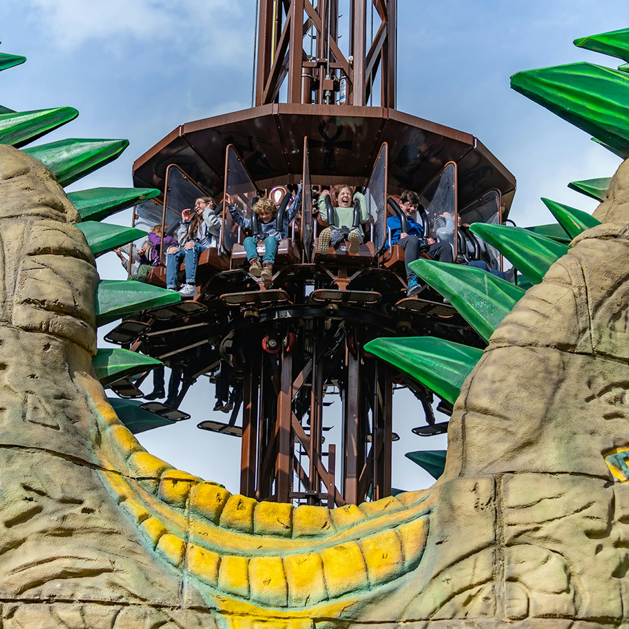 Feel the rush as riders take on the exhilarating Croc Drop surrounded by lush scenery and the thrilling ambiance of Chessington World of Adventures an unforgettable family experience awaits.